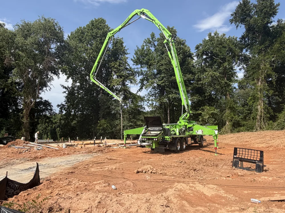 BFCP boom pump set up on a daylight jobsite